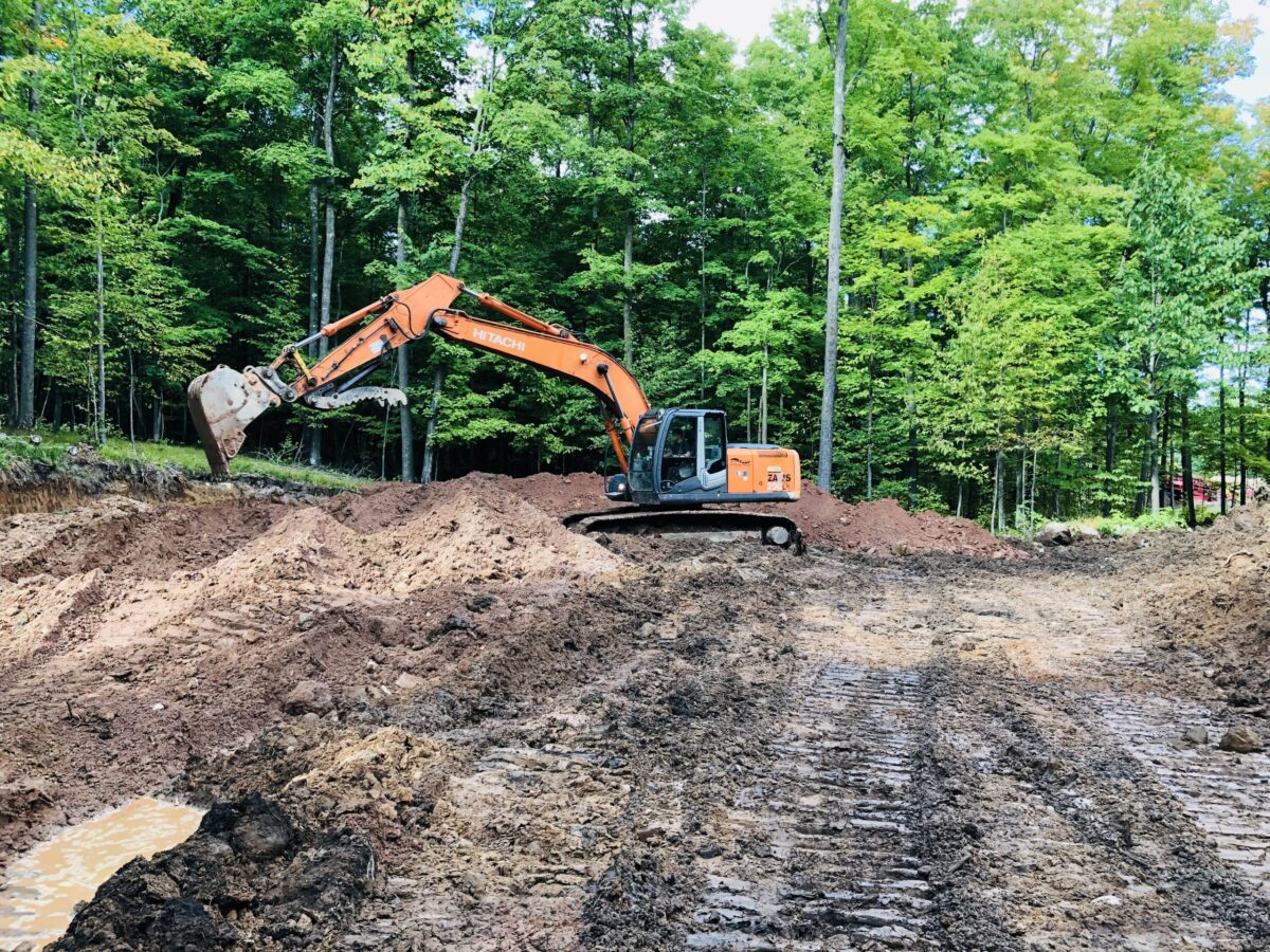 Digging a pond with a big excavator