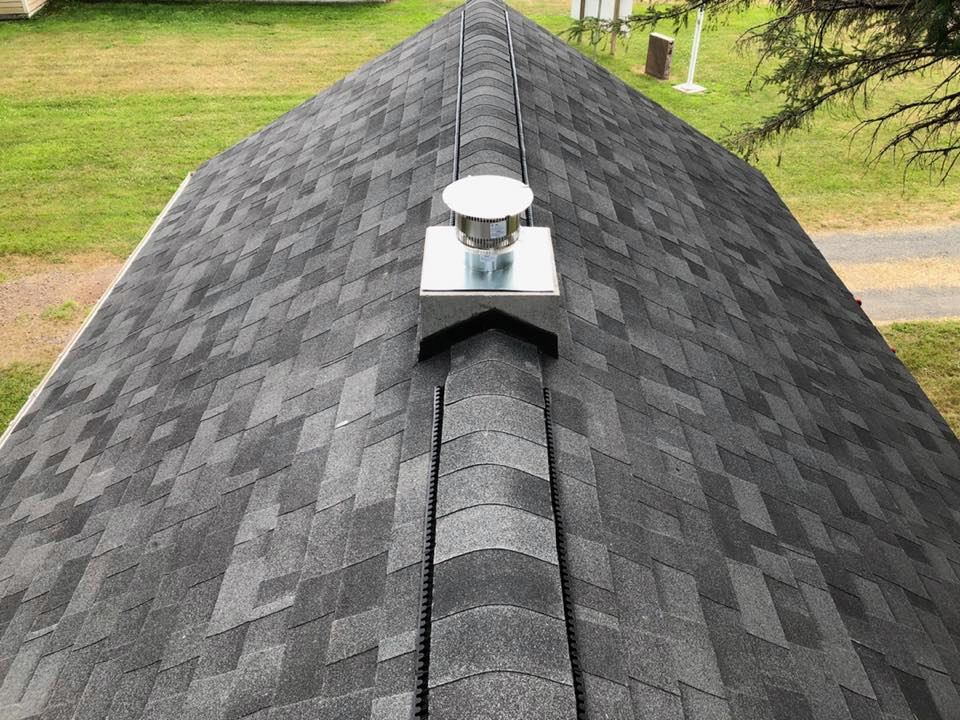 Shingle roof with new chimney and flashing
