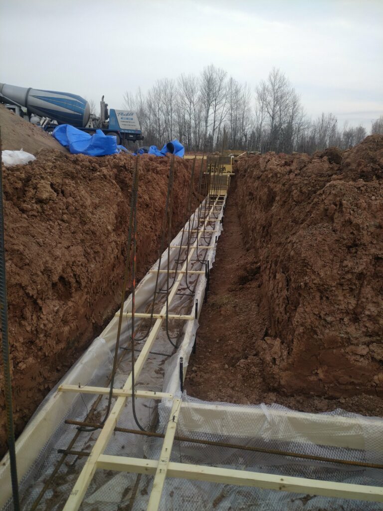 Placing footings during the excavation process