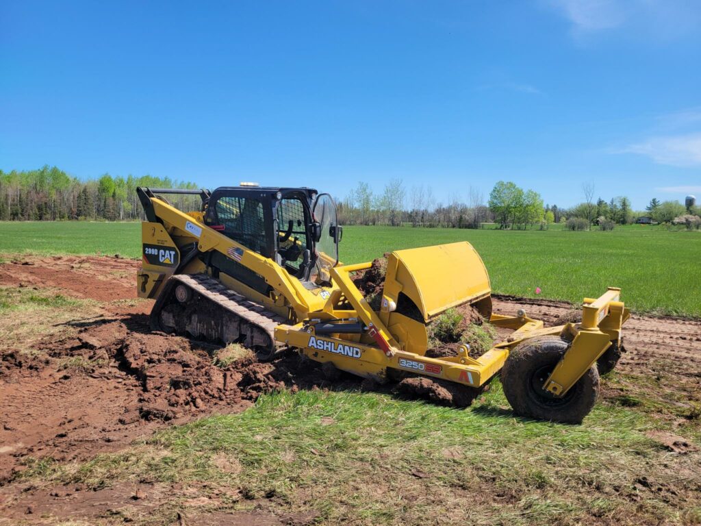 Image of large machinery clearing the site for excavation