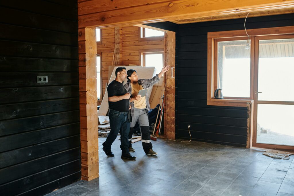 Image of a contractor showing a homeowner around the house project