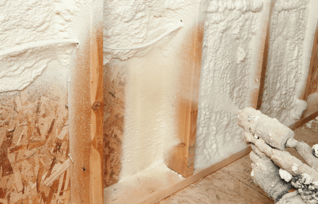 Image of someone applying spray foam insulation to a wall